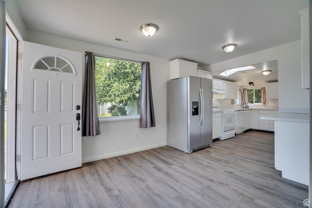 1132 S 1100 W, Provo, UT 84601 - kitchen featuring white appliances, light countertops, under cabinet range hood, white cabinetry, and light wood-type flooring