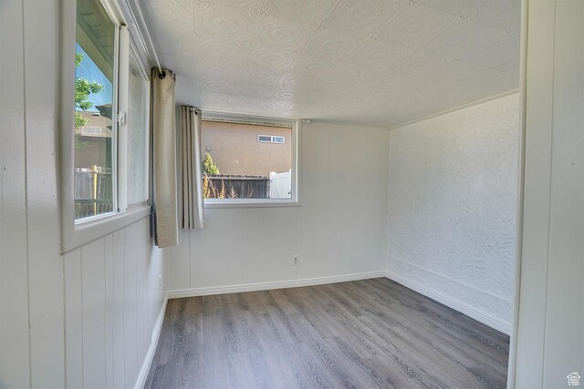 1132 S 1100 W, Provo, UT 84601 - unfurnished room with wood finished floors, healthy amount of natural light, and an ornate ceiling