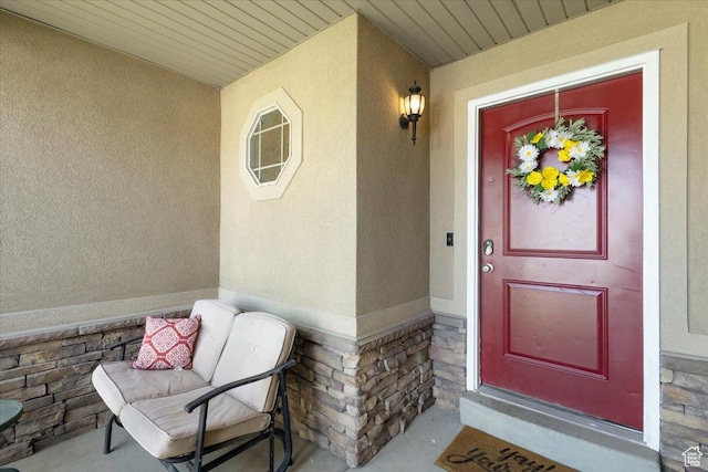 4509 S Greystock Cir W, West Valley City, UT 84120 - property entrance featuring stone siding, stucco siding, and a porch