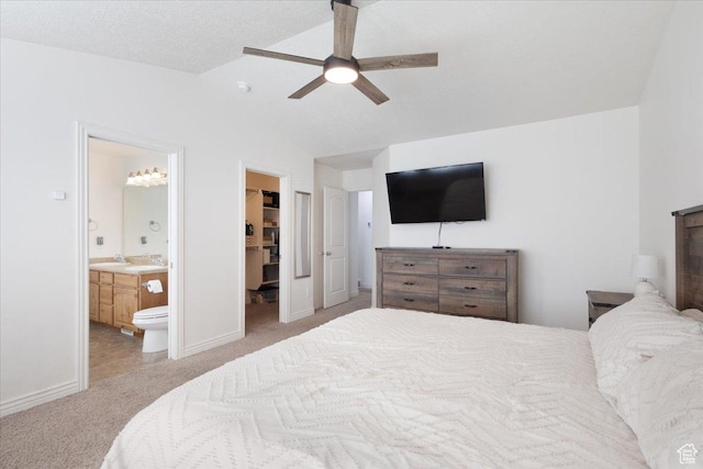 4509 S Greystock Cir W, West Valley City, UT 84120 - carpeted bedroom featuring lofted ceiling, a spacious closet, ensuite bath, ceiling fan, and a closet
