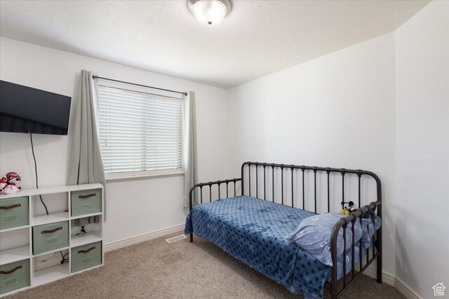 4509 S Greystock Cir W, West Valley City, UT 84120 - bedroom with carpet and a textured ceiling