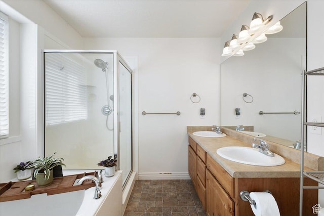 4509 S Greystock Cir W, West Valley City, UT 84120 - full bathroom with a stall shower, double vanity, a bath, and stone finish flooring