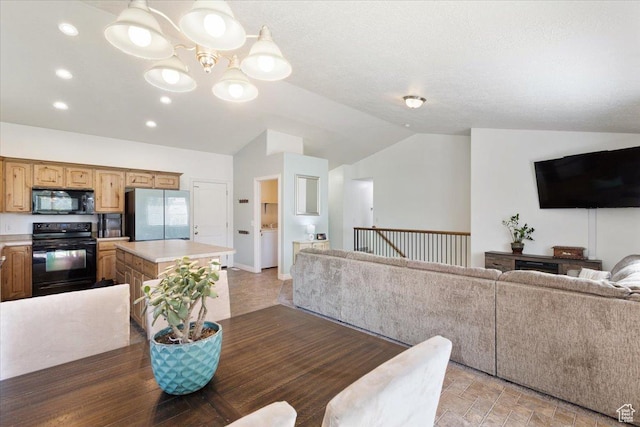 4509 S Greystock Cir W, West Valley City, UT 84120 - dining space featuring vaulted ceiling, a chandelier, and recessed lighting