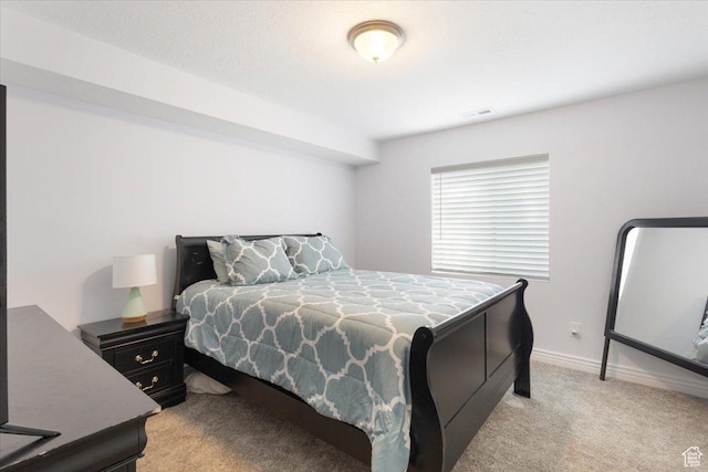 4509 S Greystock Cir W, West Valley City, UT 84120 - bedroom with light carpet and baseboards
