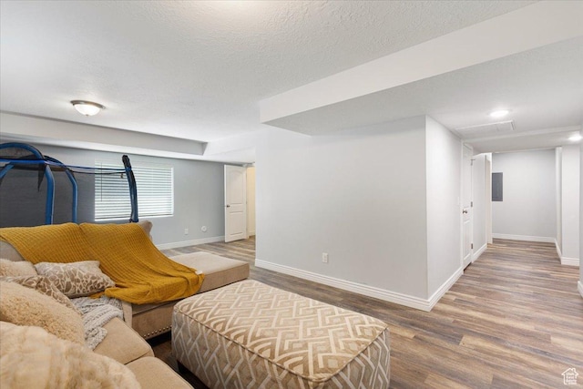 4509 S Greystock Cir W, West Valley City, UT 84120 - living room with wood finished floors and a textured ceiling