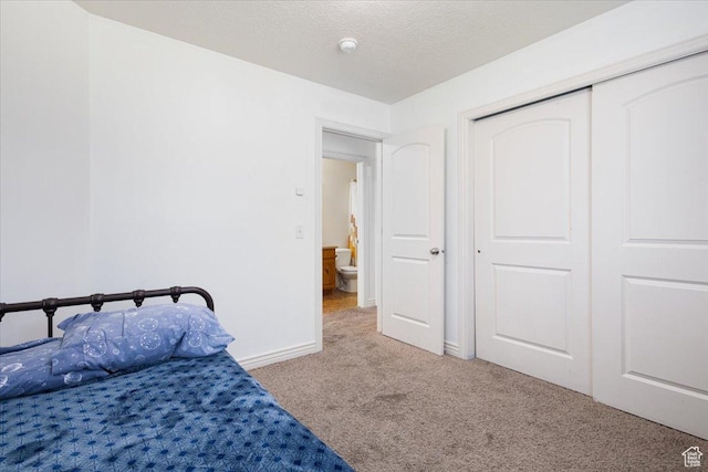 4509 S Greystock Cir W, West Valley City, UT 84120 - carpeted bedroom with a closet and a textured ceiling