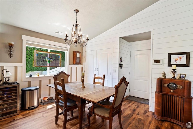 793 E 2025 N, North Ogden, UT 84414 - dining room with lofted ceiling, a chandelier, wood finished floors, wooden walls, and beverage cooler