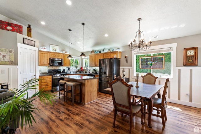 793 E 2025 N, North Ogden, UT 84414 - kitchen with appliances with stainless steel finishes, a decorative wall, a textured ceiling, dark wood-type flooring, and wainscoting