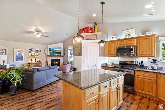 793 E 2025 N, North Ogden, UT 84414 - kitchen featuring stainless steel appliances, lofted ceiling, dark wood-style floors, a ceiling fan, and a kitchen island