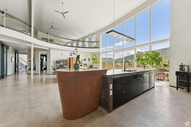 3530 N State Road 32, Marion, UT 84036 - kitchen with a kitchen island with sink, modern cabinets, dishwasher, a high ceiling, and concrete flooring
