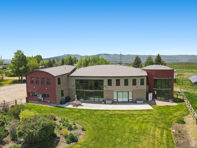 3530 N State Road 32, Marion, UT 84036 - back of house featuring stucco siding, a patio area, a metal roof, and a mountain view