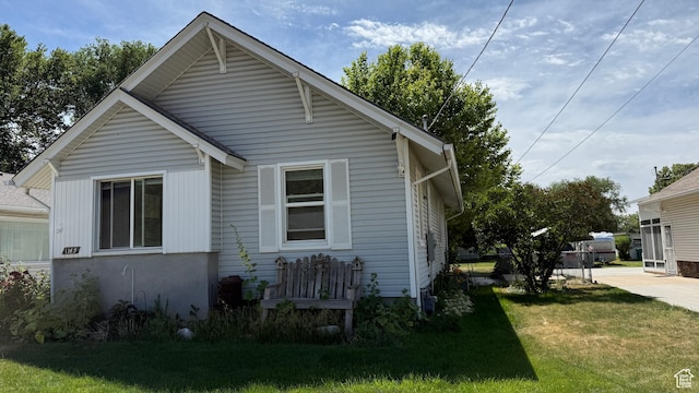 1145 S Liberty Ave E, Ogden, UT 84404 - view of home's exterior featuring a yard