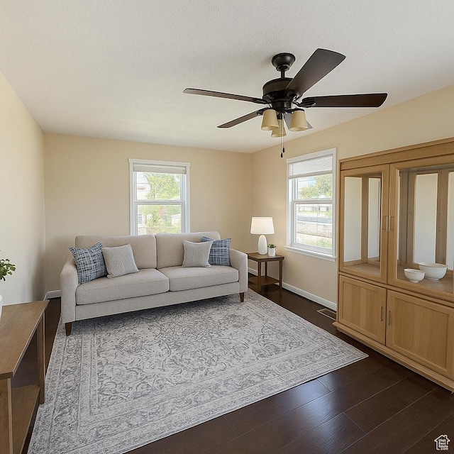 1145 S Liberty Ave E, Ogden, UT 84404 - living room featuring plenty of natural light, a ceiling fan, and dark wood-style floors