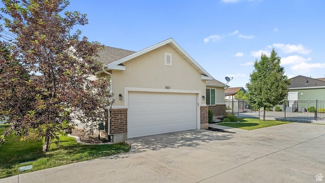 950 N 90 W, Santaquin, UT 84655 - view of front of property with brick siding, driveway, a garage, and stucco siding