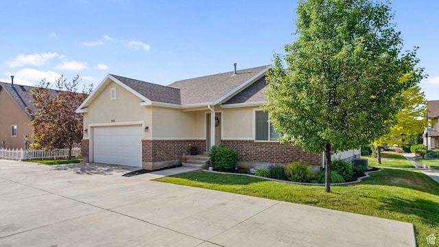 950 N 90 W, Santaquin, UT 84655 - view of front facade featuring driveway, stucco siding, brick siding, a garage, and a shingled roof