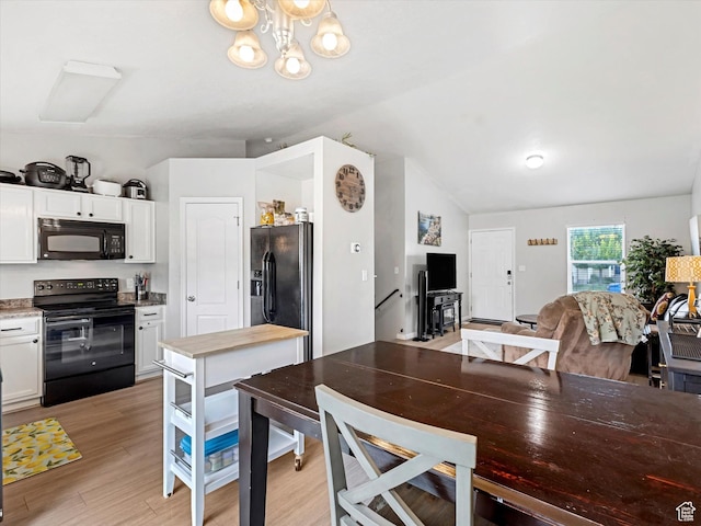 2419 E Hitching Post Dr N, Eagle Mountain, UT 84005 - dining area featuring lofted ceiling, light wood finished floors, and a chandelier