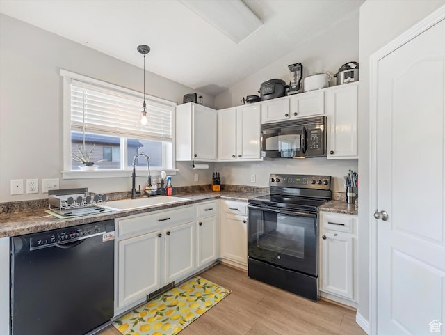 2419 E Hitching Post Dr N, Eagle Mountain, UT 84005 - kitchen with black appliances, white cabinets, light wood-style flooring, pendant lighting, and dark countertops