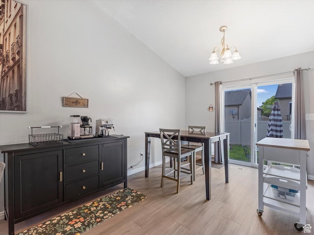 2419 E Hitching Post Dr N, Eagle Mountain, UT 84005 - dining area featuring a chandelier, vaulted ceiling, and light wood-type flooring