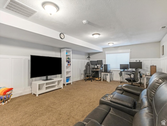 2419 E Hitching Post Dr N, Eagle Mountain, UT 84005 - carpeted living room featuring a decorative wall, an office area, a textured ceiling, and wainscoting