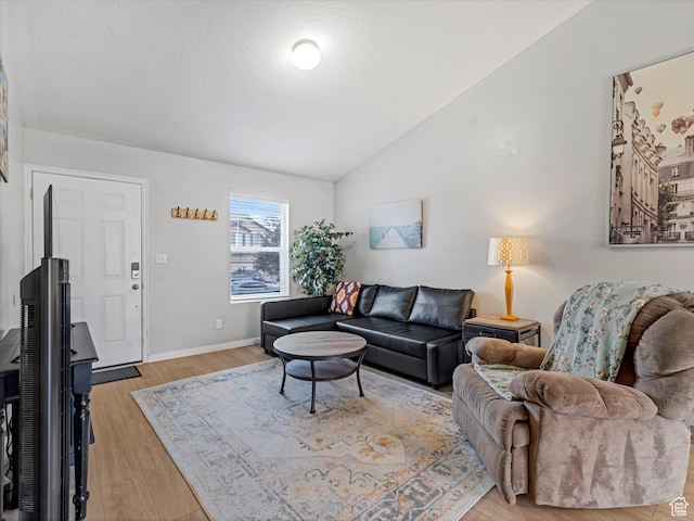 2419 E Hitching Post Dr N, Eagle Mountain, UT 84005 - living room with lofted ceiling and light wood-type flooring