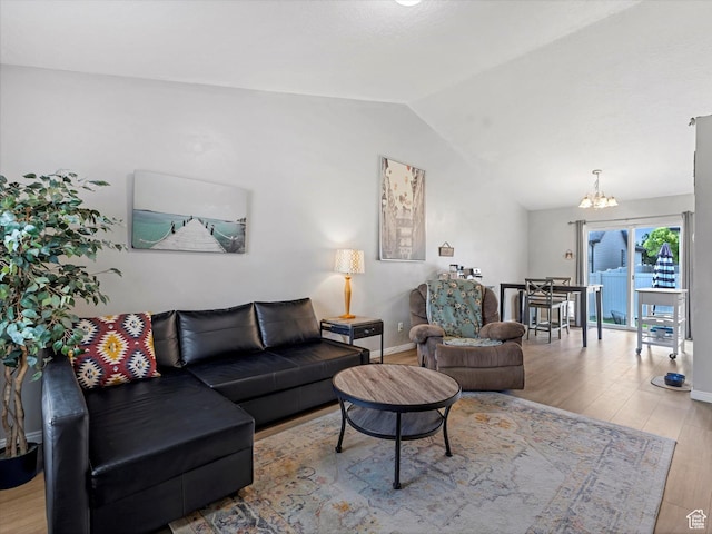 2419 E Hitching Post Dr N, Eagle Mountain, UT 84005 - living room with a chandelier, wood finished floors, and vaulted ceiling