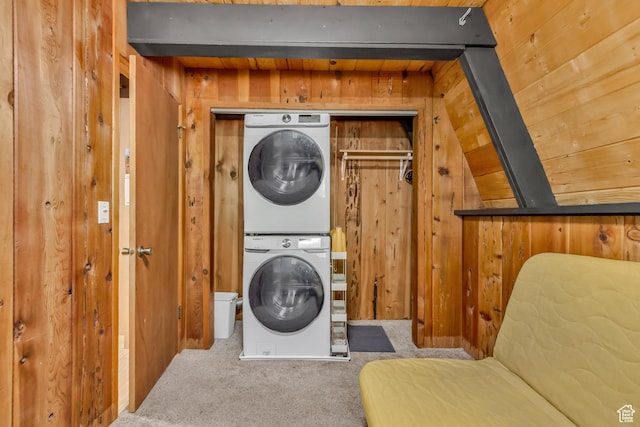 4601 Conifer Dr, Oakley, UT 84055 - washroom with stacked washer and clothes dryer, wood walls, and carpet floors