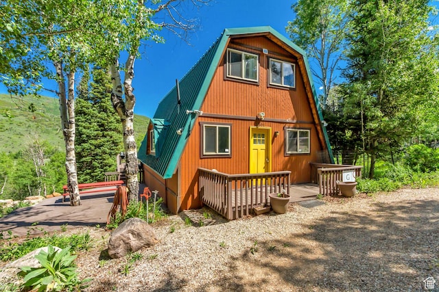 4601 Conifer Dr, Oakley, UT 84055 - back of house featuring a gambrel roof, a metal roof, and a deck