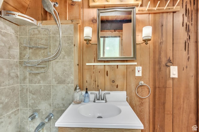 4601 Conifer Dr, Oakley, UT 84055 - bathroom featuring vanity, wood walls, and washtub / shower combination