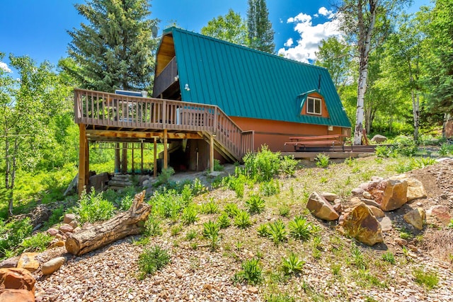 4601 Conifer Dr, Oakley, UT 84055 - back of property featuring a wooden deck, a metal roof, stairway, and a gambrel roof