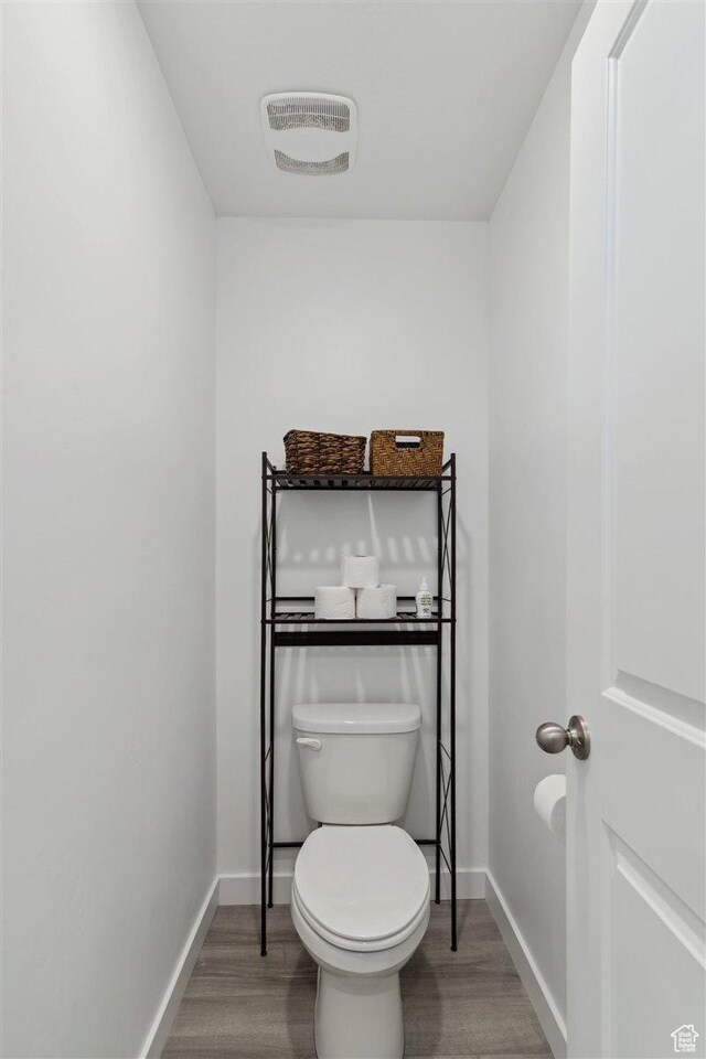 1010 E Bigelow Ave, Layton, UT 84040 - bathroom with wood finished floors and toilet