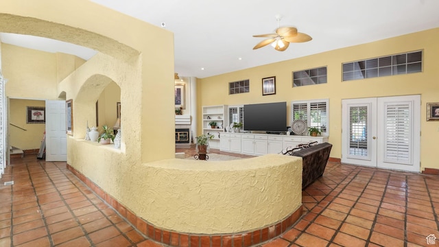 3175 N 140 W, Provo, UT 84604 - tiled living room featuring a high ceiling, a ceiling fan, and arched walkways
