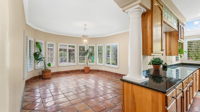 3175 N 140 W, Provo, UT 84604 - kitchen featuring ornate columns, tile patterned floors, ornamental molding, pendant lighting, and brown cabinetry