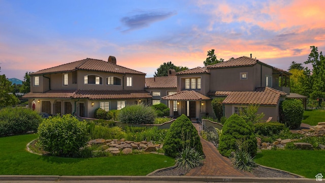 3175 N 140 W, Provo, UT 84604 - mediterranean / spanish-style house featuring a tile roof, a front yard, and stucco siding
