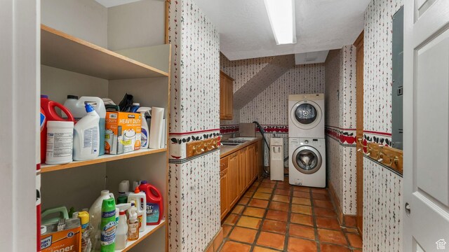 3175 N 140 W, Provo, UT 84604 - washroom with wallpapered walls and stacked washer / drying machine