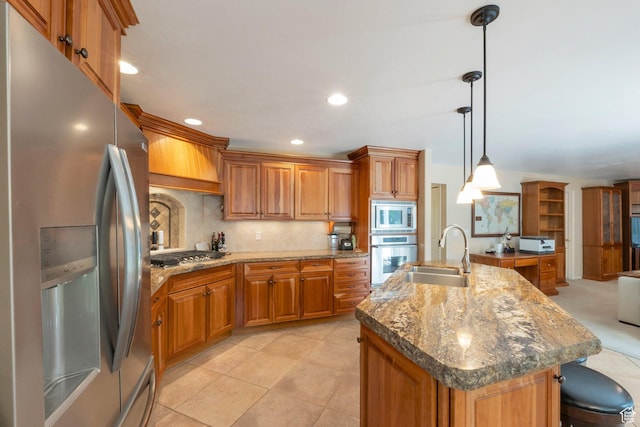 1028 E 140 N, Lindon, UT 84042 - kitchen with appliances with stainless steel finishes, brown cabinets, decorative backsplash, an island with sink, and recessed lighting