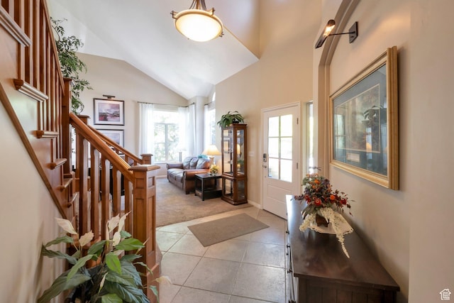 1028 E 140 N, Lindon, UT 84042 - foyer with light tile patterned flooring, lofted ceiling, stairs, and light carpet