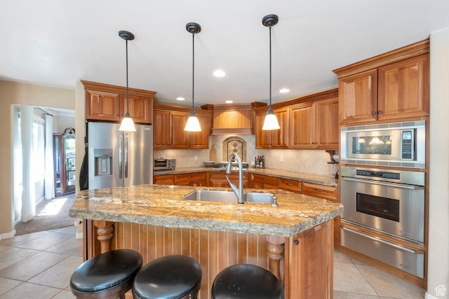 1028 E 140 N, Lindon, UT 84042 - kitchen featuring stainless steel appliances, a warming drawer, brown cabinetry, light tile patterned floors, and recessed lighting