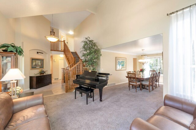 1028 E 140 N, Lindon, UT 84042 - carpeted living room featuring a towering ceiling, stairs, and a chandelier