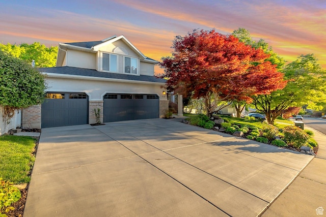 1028 E 140 N, Lindon, UT 84042 - view of front of house featuring an attached garage, stucco siding, and concrete driveway