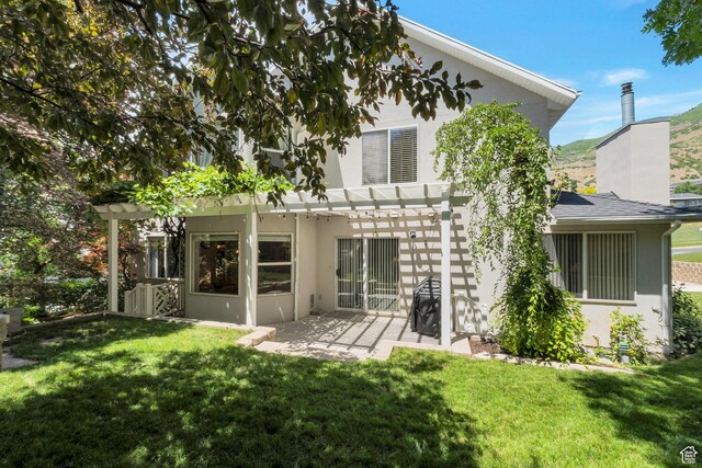 1028 E 140 N, Lindon, UT 84042 - rear view of house with a pergola, stucco siding, a lawn, and a patio area