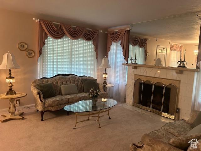 1567 E Westminster Ave, Salt Lake City, UT 84105 - living area featuring carpet floors and a tile fireplace
