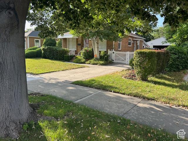 1567 E Westminster Ave, Salt Lake City, UT 84105 - view of property hidden behind natural elements featuring brick siding and a gate