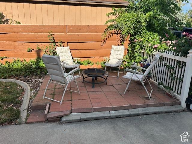 1567 E Westminster Ave, Salt Lake City, UT 84105 - view of patio / terrace with an outdoor fire pit