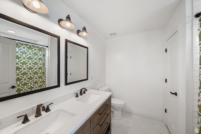 1051 W Castleton Dr, North Salt Lake, UT 84054 - bathroom featuring double vanity and tile patterned flooring