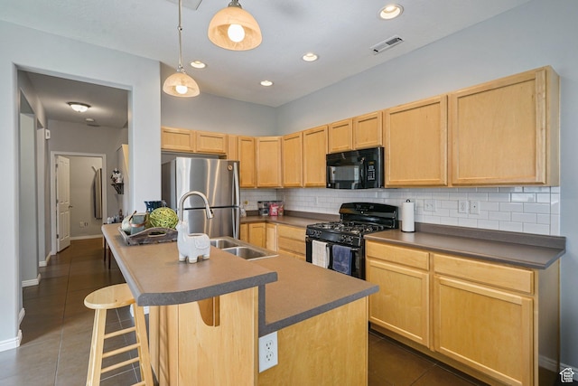 1051 W Castleton Dr, North Salt Lake, UT 84054 - kitchen with black appliances, light brown cabinets, tasteful backsplash, dark countertops, and dark tile patterned floors
