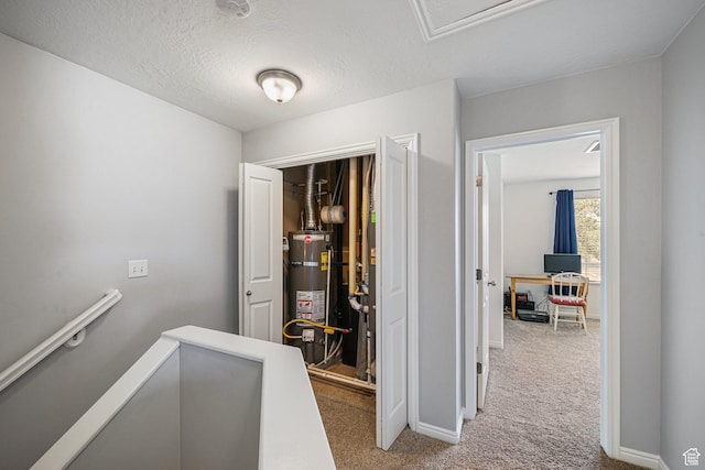 1051 W Castleton Dr, North Salt Lake, UT 84054 - hallway with strapped water heater, carpet, an upstairs landing, and a textured ceiling