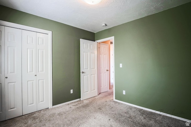 562 S 400 E, Ivins, UT 84738 - unfurnished bedroom featuring carpet, a closet, and a textured ceiling