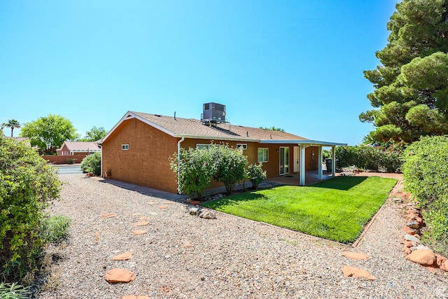 562 S 400 E, Ivins, UT 84738 - back of house featuring stucco siding, a lawn, and a patio area