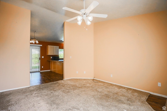 562 S 400 E, Ivins, UT 84738 - unfurnished living room with dark colored carpet, a chandelier, and ceiling fan