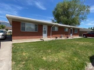856 N 600 E, Lehi, UT 84043 - ranch-style home featuring a front yard and brick siding